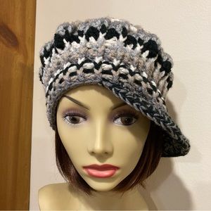 Fun, snappy, chic, handknit, Boho hippie style, newsboy, cap. Multi black, gray.